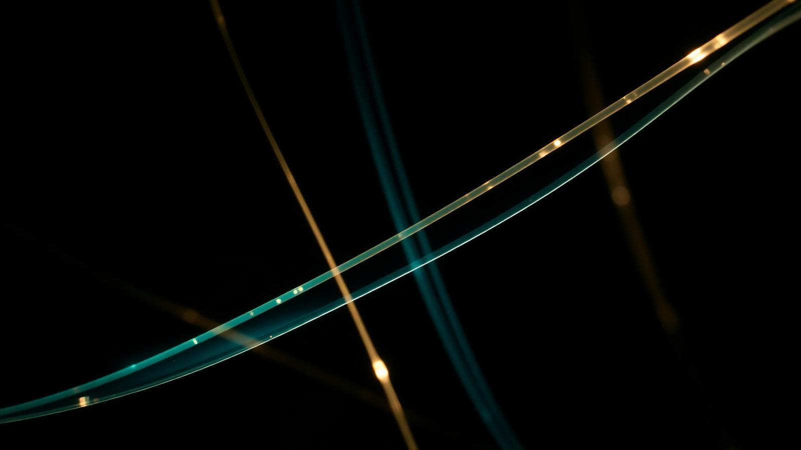 Close-up of illuminated fibre optic strands representing secure data transmission